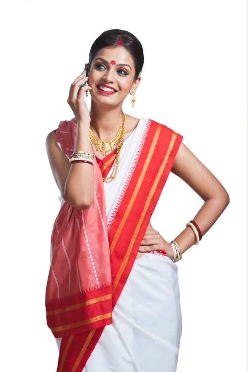 Bengali woman in white sharee with red border