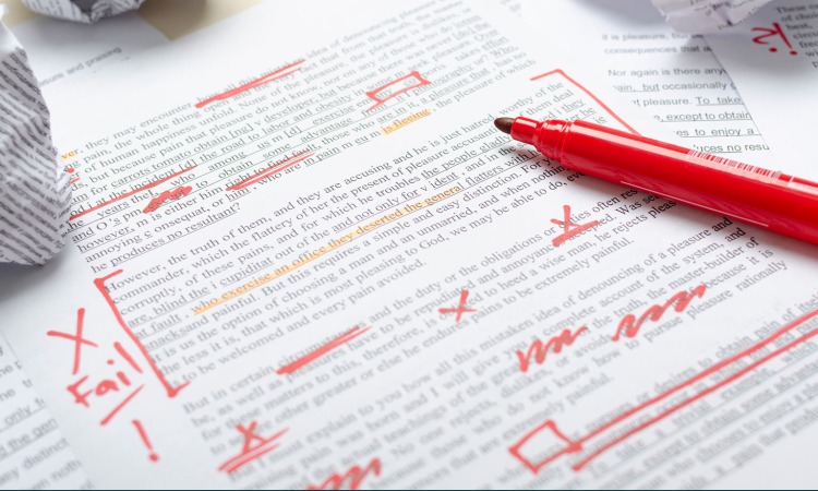 A red pen and a piece of content correction